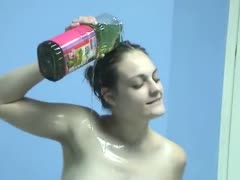 Filthy skank pours up vegetable oil all over her body 